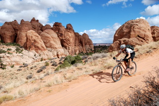 Travis Histed Flying Down a Sandy Hill at the 24 Hours of Moab